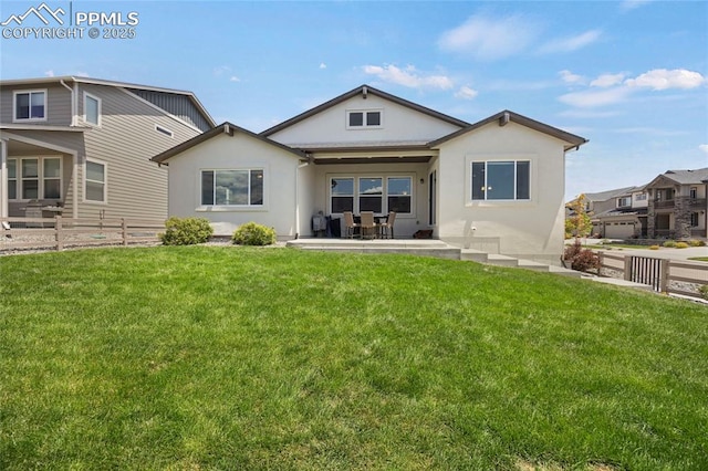 10076 Oro Belle Ct, Colorado Springs, CO 80924 - rear view of property with stucco siding and a patio