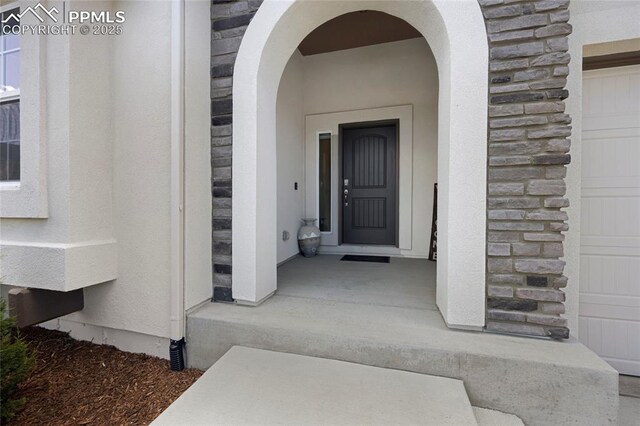 10076 Oro Belle Ct, Colorado Springs, CO 80924 - view of exterior entry with stone siding