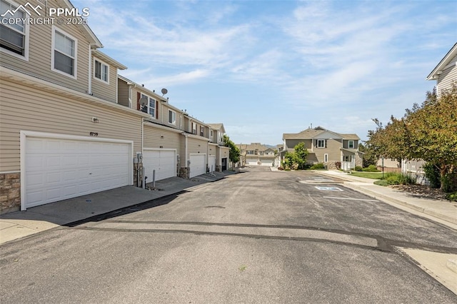 8753 Bamboo Grv, Colorado Springs, CO 80951 - view of asphalt street with a residential view and sidewalks