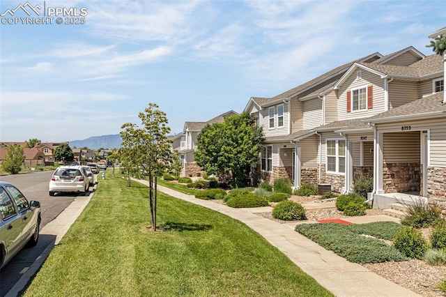 8753 Bamboo Grv, Colorado Springs, CO 80951 - view of green lawn with a residential view and a mountain view