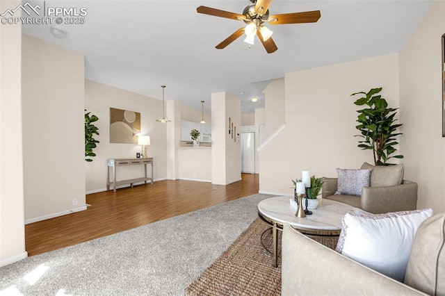 8753 Bamboo Grv, Colorado Springs, CO 80951 - carpeted living area with ceiling fan and wood finished floors