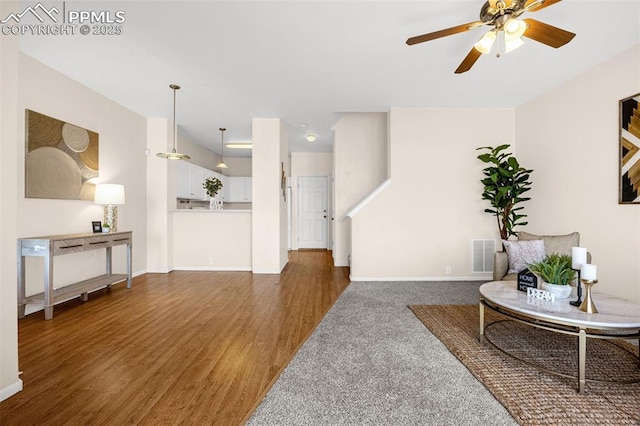 8753 Bamboo Grv, Colorado Springs, CO 80951 - living area featuring ceiling fan and wood finished floors