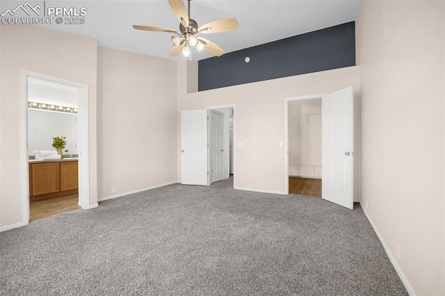 8753 Bamboo Grv, Colorado Springs, CO 80951 - unfurnished bedroom featuring carpet floors, a high ceiling, a spacious closet, connected bathroom, and ceiling fan
