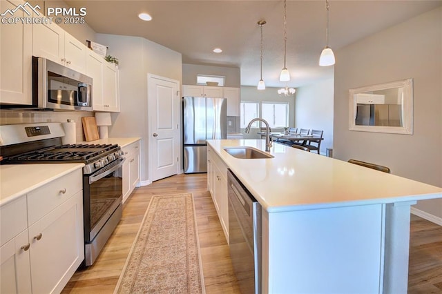 6069 Inman Vw, Colorado Springs, CO 80924 - kitchen featuring appliances with stainless steel finishes, light wood-style flooring, light countertops, and recessed lighting