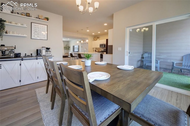 6069 Inman Vw, Colorado Springs, CO 80924 - dining room featuring a chandelier and wood finished floors