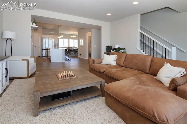 6069 Inman Vw, Colorado Springs, CO 80924 - living room featuring recessed lighting, a chandelier, and stairs