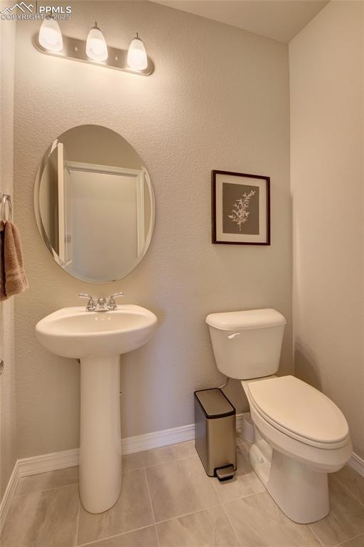 6069 Inman Vw, Colorado Springs, CO 80924 - bathroom featuring toilet and tile patterned flooring