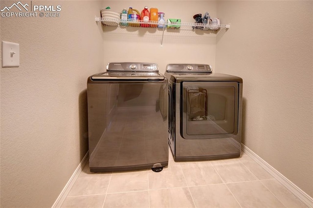 6069 Inman Vw, Colorado Springs, CO 80924 - laundry room featuring washing machine and clothes dryer and tile patterned floors