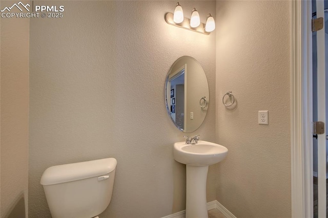 6069 Inman Vw, Colorado Springs, CO 80924 - half bath featuring toilet and baseboards