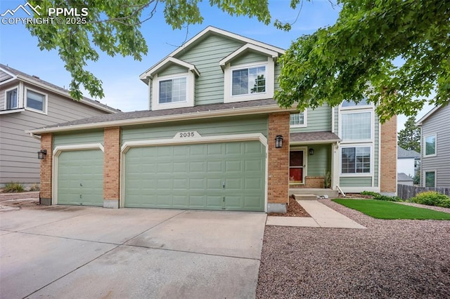 2035 Springcrest Rd, Colorado Springs, CO 80920 - view of front facade featuring brick siding, concrete driveway, and a garage
