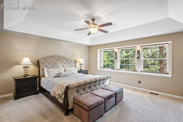 235 Haversham Dr, Colorado Springs, CO 80906 - bedroom with a tray ceiling, carpet floors, and a ceiling fan
