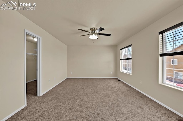 7385 Forest Meadows Ave, Colorado Springs, CO 80908 - empty room with carpet floors and a ceiling fan