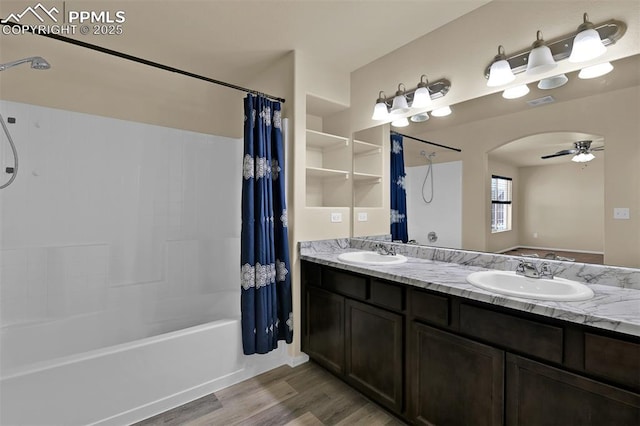 7385 Forest Meadows Ave, Colorado Springs, CO 80908 - full bathroom featuring wood finished floors, shower / bath combo, double vanity, and a ceiling fan