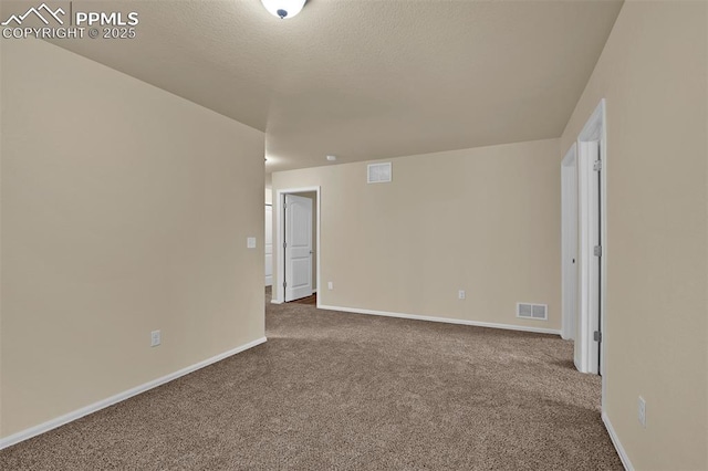 7385 Forest Meadows Ave, Colorado Springs, CO 80908 - carpeted empty room featuring baseboards and a textured ceiling