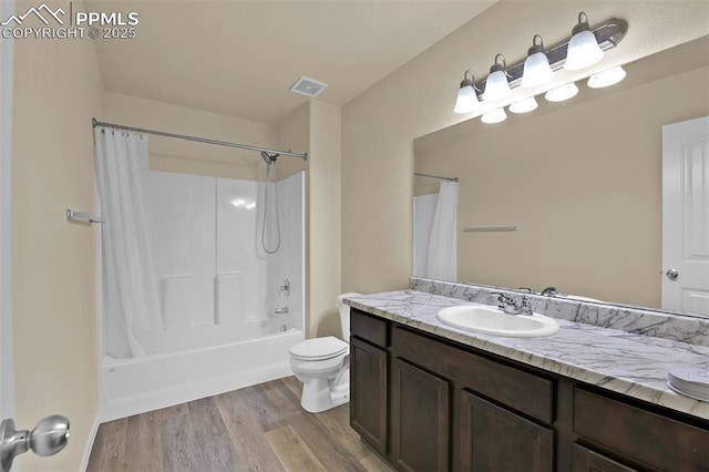 7385 Forest Meadows Ave, Colorado Springs, CO 80908 - full bath with vanity, wood finished floors, and shower / bath combo