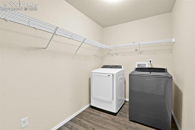 7385 Forest Meadows Ave, Colorado Springs, CO 80908 - laundry room featuring washing machine and dryer and wood finished floors