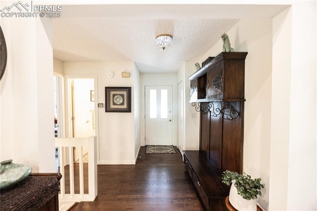 2125 Glenhill Rd, Colorado Springs, CO 80906 - mudroom featuring a textured ceiling and dark wood finished floors