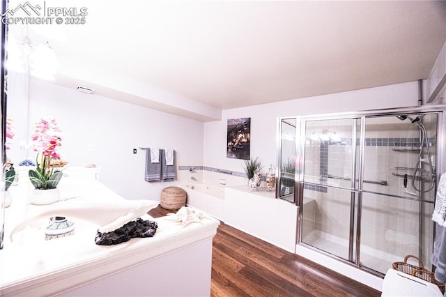 2125 Glenhill Rd, Colorado Springs, CO 80906 - bathroom with a bath, wood finished floors, and a stall shower