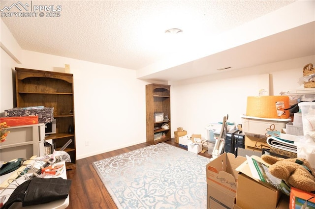 2125 Glenhill Rd, Colorado Springs, CO 80906 - interior space with dark wood finished floors and a textured ceiling