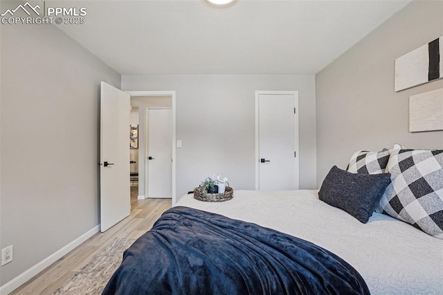 5300 E Cherry Creek Dr Unit 918, Denver, CO 80246 - bedroom featuring light wood finished floors and baseboards