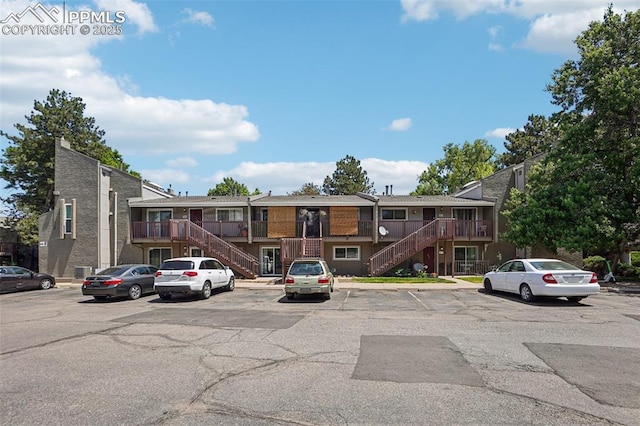 5300 E Cherry Creek Dr Unit 918, Denver, CO 80246 - view of front of house featuring stairs and uncovered parking