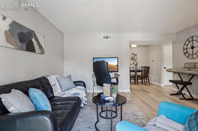 5300 E Cherry Creek Dr Unit 918, Denver, CO 80246 - living room featuring wood finished floors and baseboards