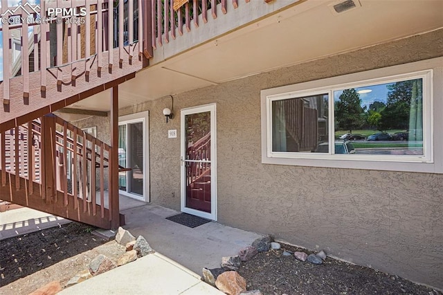 5300 E Cherry Creek Dr Unit 918, Denver, CO 80246 - doorway to property with stucco siding