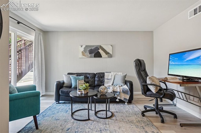 5300 E Cherry Creek Dr Unit 918, Denver, CO 80246 - living area featuring wood finished floors