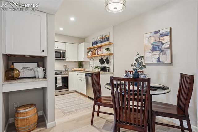 5300 E Cherry Creek Dr Unit 918, Denver, CO 80246 - dining space featuring light wood-style floors and recessed lighting