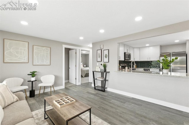 1880 Southmoor Dr, Fountain, CO 80817 - living area featuring recessed lighting and light wood finished floors