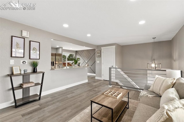 1880 Southmoor Dr, Fountain, CO 80817 - living room featuring wood finished floors and recessed lighting