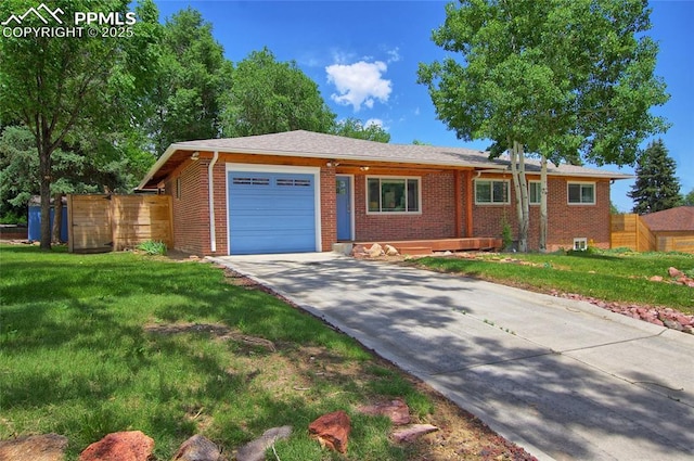 1018 Saturn Dr, Colorado Springs, CO 80905 - ranch-style house with an attached garage, brick siding, and driveway