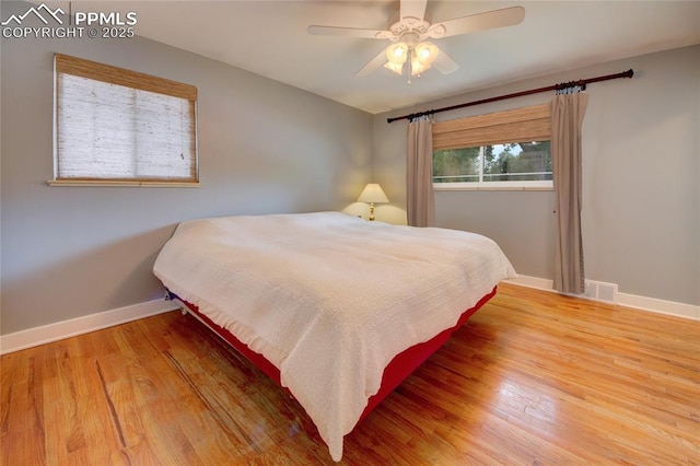 1018 Saturn Dr, Colorado Springs, CO 80905 - bedroom featuring wood finished floors and ceiling fan