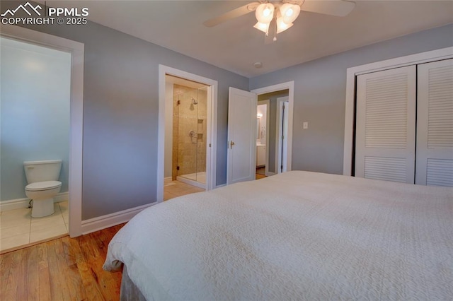 1018 Saturn Dr, Colorado Springs, CO 80905 - bedroom with a closet, ensuite bath, wood finished floors, and a ceiling fan