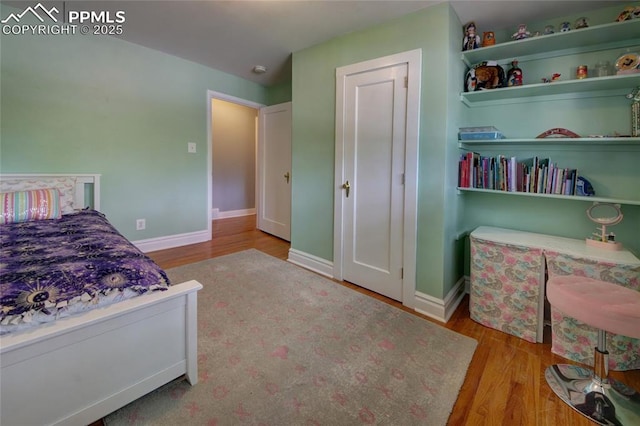 1018 Saturn Dr, Colorado Springs, CO 80905 - bedroom with wood finished floors