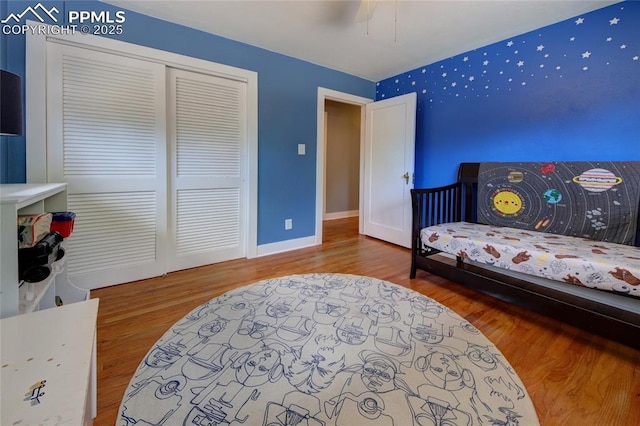 1018 Saturn Dr, Colorado Springs, CO 80905 - bedroom featuring wood finished floors, a closet, and ceiling fan