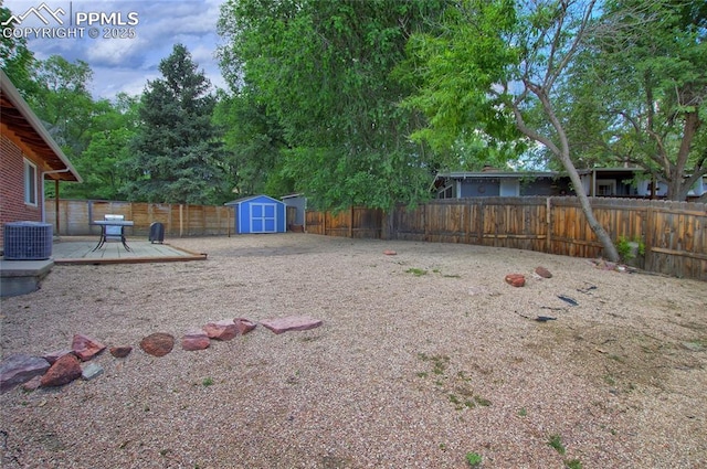 1018 Saturn Dr, Colorado Springs, CO 80905 - fenced backyard featuring a deck and a shed
