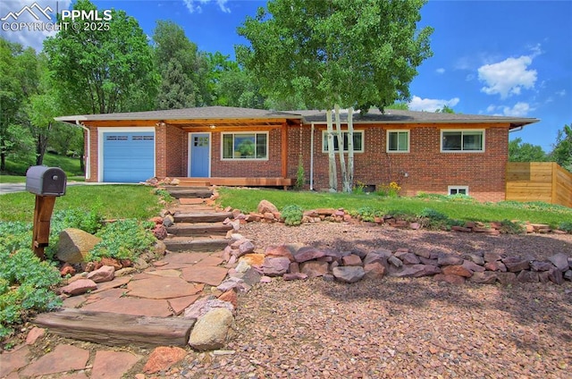 1018 Saturn Dr, Colorado Springs, CO 80905 - single story home with a garage and brick siding