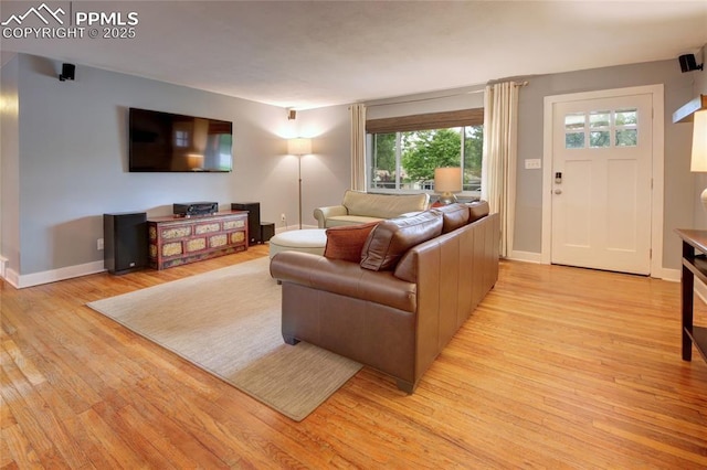 1018 Saturn Dr, Colorado Springs, CO 80905 - living room featuring light wood finished floors and baseboards