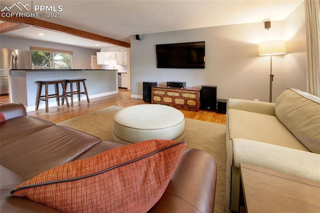 1018 Saturn Dr, Colorado Springs, CO 80905 - living room with light wood finished floors, recessed lighting, and beam ceiling