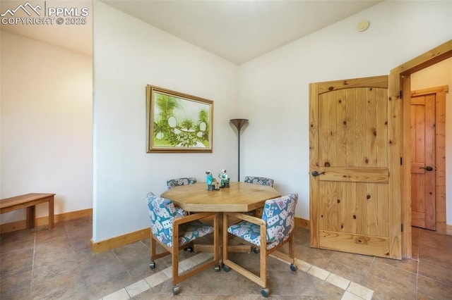 71 Crestone Cir, Florissant, CO 80816 - dining room featuring lofted ceiling and stone finish flooring