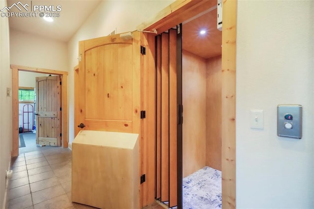 71 Crestone Cir, Florissant, CO 80816 - bathroom featuring tile patterned flooring and vaulted ceiling