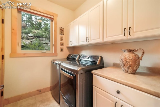 71 Crestone Cir, Florissant, CO 80816 - laundry room featuring cabinet space and washing machine and dryer