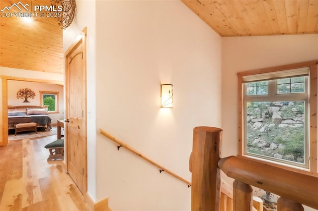 71 Crestone Cir, Florissant, CO 80816 - staircase with wood finished floors, plenty of natural light, wood ceiling, and lofted ceiling