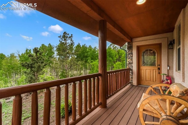 71 Crestone Cir, Florissant, CO 80816 - wooden deck featuring view of scattered trees