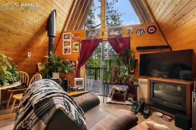 71 Crestone Cir, Florissant, CO 80816 - living area with wood walls, wood ceiling, lofted ceiling, and carpet floors