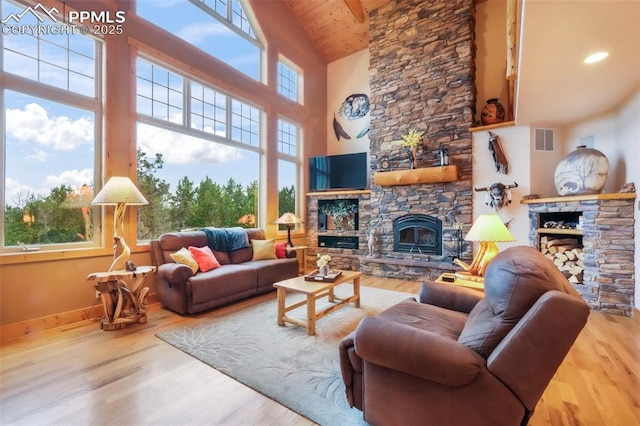 71 Crestone Cir, Florissant, CO 80816 - living area with a fireplace, high vaulted ceiling, wood finished floors, and wood ceiling