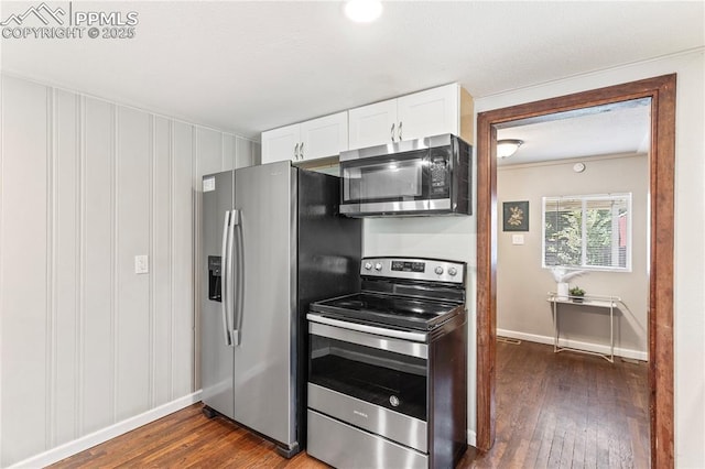 121 Via, San Miguel, Manitou Springs, CO 80829 - kitchen with appliances with stainless steel finishes, white cabinetry, and dark wood-style floors