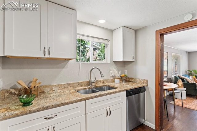 121 Via, San Miguel, Manitou Springs, CO 80829 - kitchen with stainless steel dishwasher, dark wood-type flooring, white cabinetry, light stone counters, and a textured ceiling