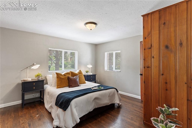 121 Via, San Miguel, Manitou Springs, CO 80829 - bedroom with dark wood-style flooring, multiple windows, and a textured ceiling